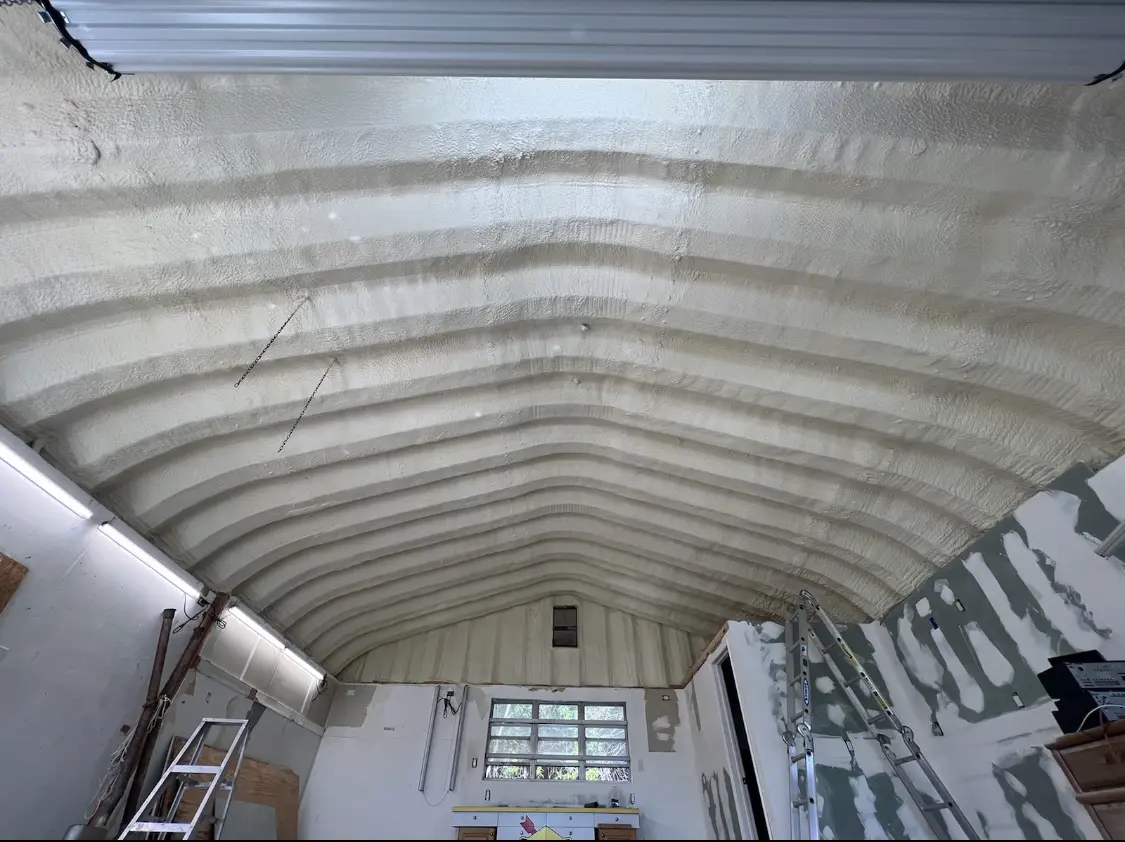 Spray polyurethane foam applied to the underside of a metal roof deck in Forest Lake